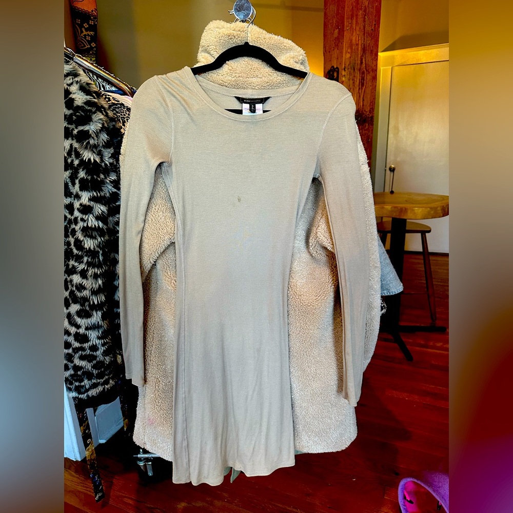 Tanned BCBGMAXARIA long sleeved light dress that comfortably hugs the body.